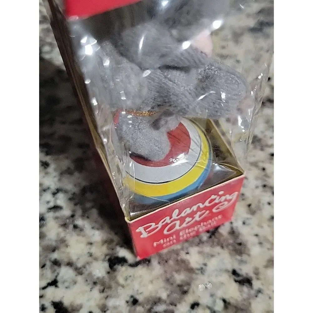 Balancing Act‎ Mini Elephant On Ball